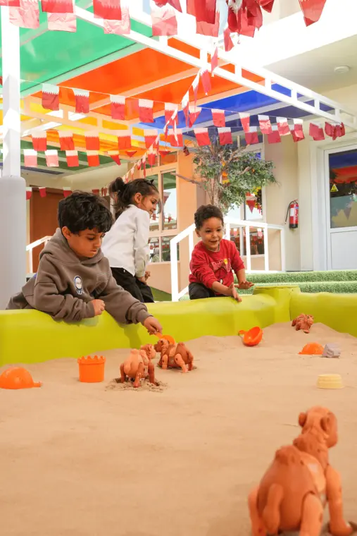 Children playing together in the sandpit