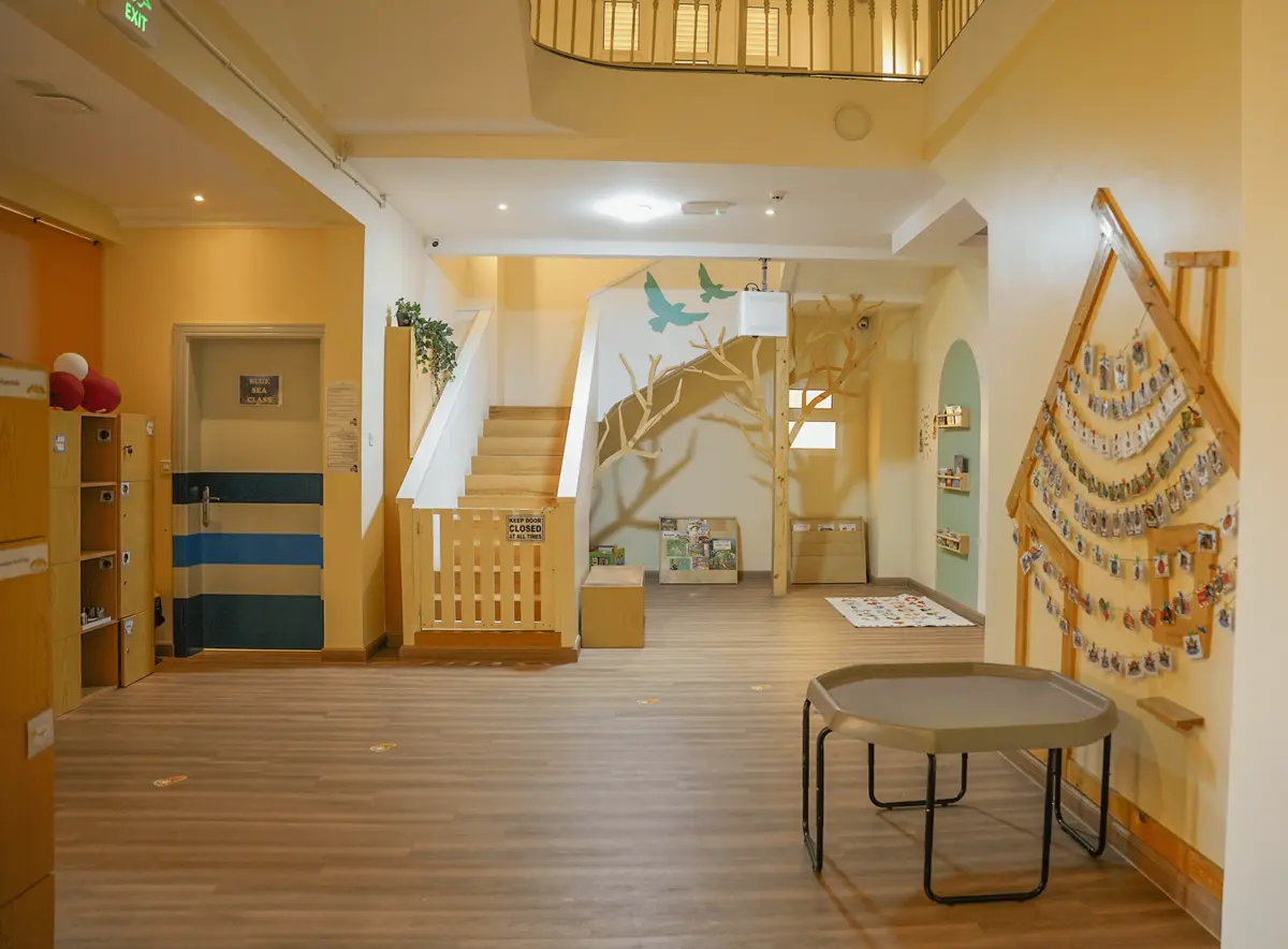 Our indoor garden with a hand-painted tree mural